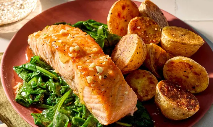 Honey-glazed salmon with roasted potatoes and spinach